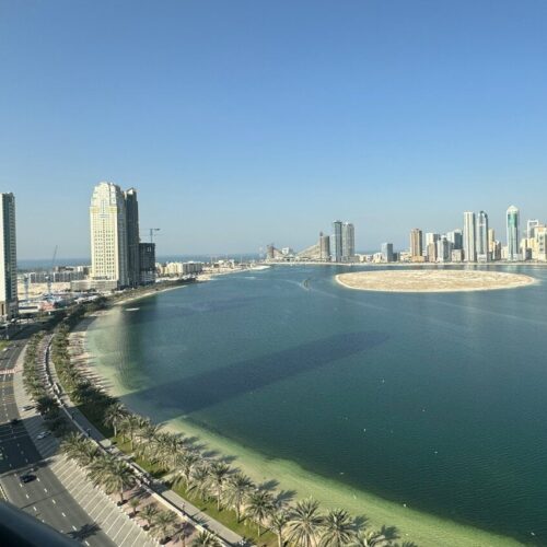 a large body of water surrounded by tall buildings