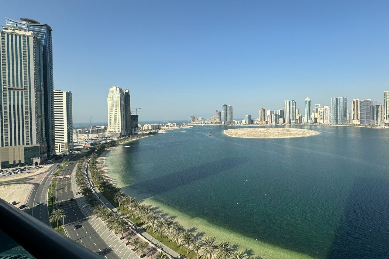 a large body of water surrounded by tall buildings